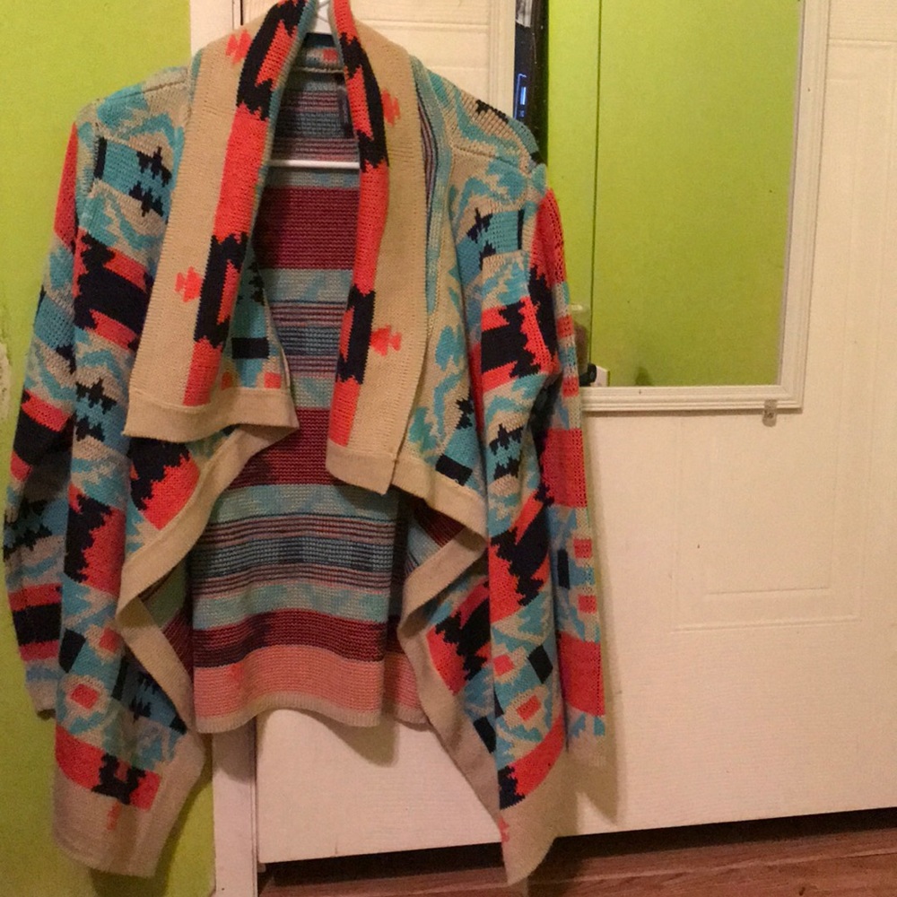 Blue, black, pink, and tan cardigan.